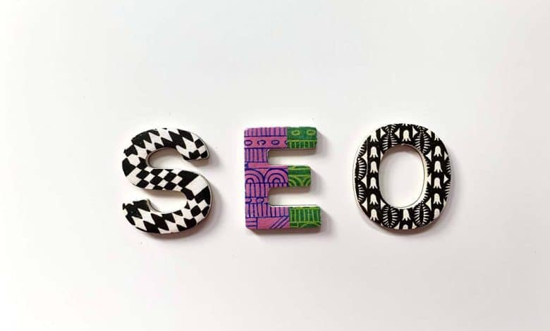 The word "seo" is formed with uniquely patterned letters on a plain white background. each letter is decorated distinctly with black and white geometric designs and vibrant purple and green abstract patterns.