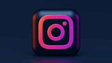 3d rendering of the instagram logo icon with a glossy finish, featuring a pink and purple gradient outline and a dark background. the icon includes the classic camera and dot design.