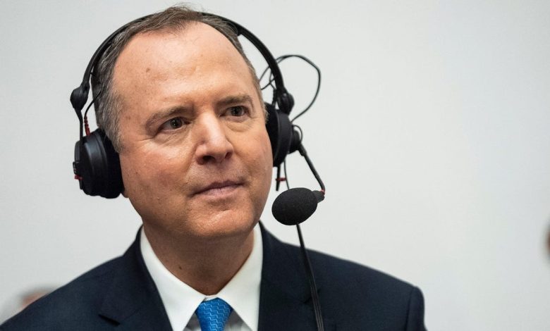 A middle-aged man wearing a suit and a headset with a microphone, looking attentively to the side. He appears to be engaged in listening or communication about proposed laws in a professional setting.