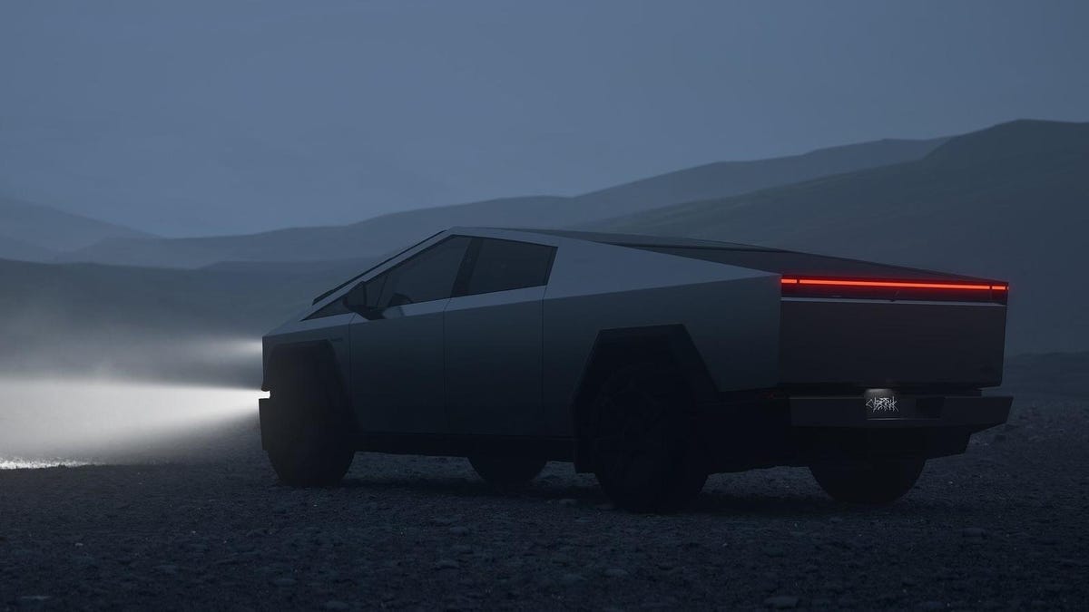 A futuristic, polygonal-designed Cybertruck with a matte finish, shown in a twilight misty setting with glowing red taillights, parked on a damp road surrounded by hazy,