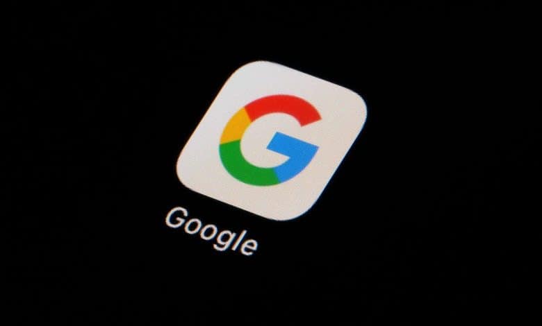 The image shows the Google app icon, featuring a capital letter "g" in colors blue, red, yellow, and green against a white background, displayed on a device screen with a dark, nearly