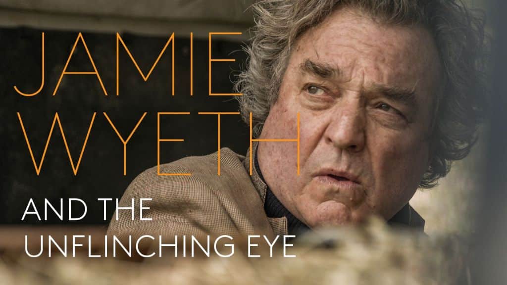 This image features a close-up of Jamie Wyeth, an older man with disheveled gray hair and focused expression, peering slightly off-camera. Bold orange text over the image reads "Jamie Wy