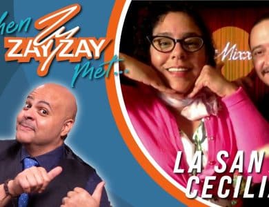 Promotional image featuring a bald man pointing at himself on the left, and a man and a woman smiling on the right, labeled "when zayzay met... La Santa Cecilia." Bright