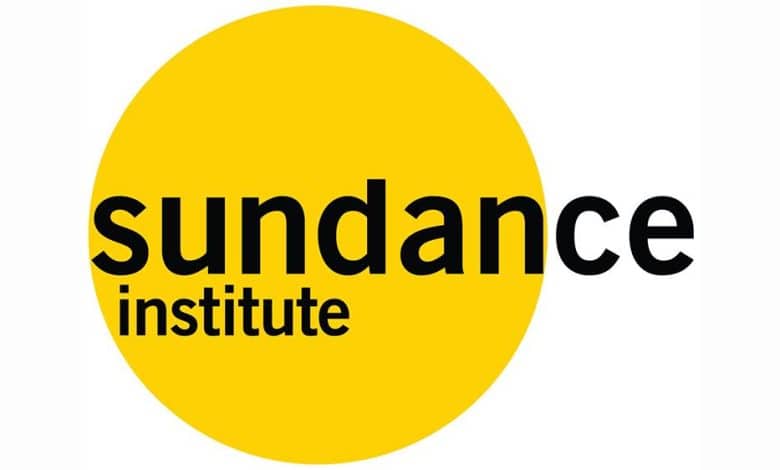 Logo of the sundance institute featuring the word "sundance" in black lowercase letters on a yellow circle, with "institute" in smaller lowercase letters underneath.