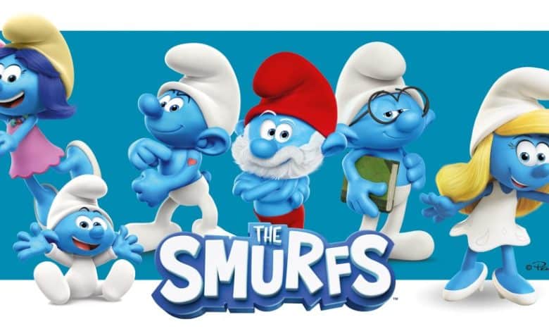 Illustration of five Smurfs' cast members revealed, including Papa Smurf in the center, with the words "the Smurfs" prominently displayed below. Each smurf is uniquely posed and