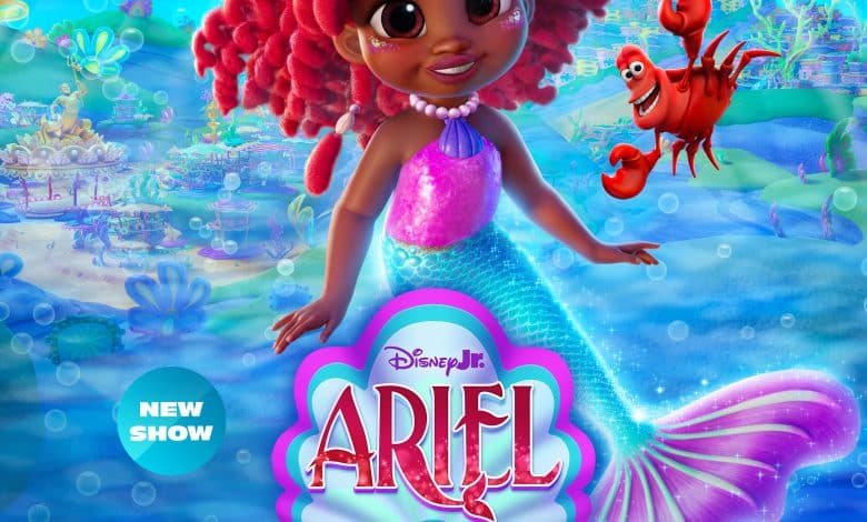 Colorful poster for the new Disney Junior show "Ariel" featuring a young mermaid with vibrant red hair and a purple tail, smiling underwater. A yellow fish and red crab accompany her. The background showcases an enchanting underwater kingdom. Premiering June 27 on Disney Junior and Disney+.
