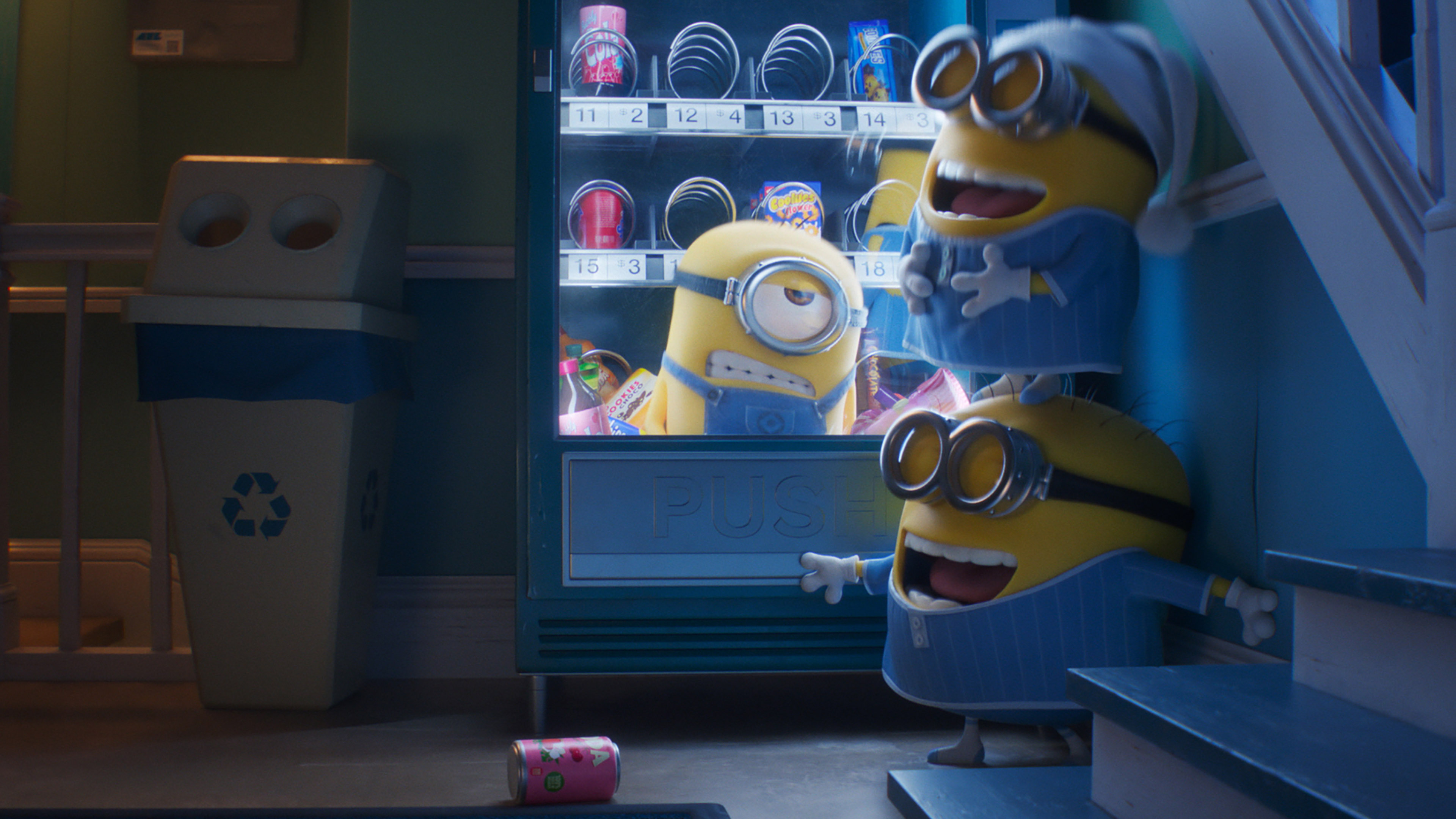 Three minions are in front of a brightly lit vending machine. One minion is trapped inside, reaching out, while the other two try to free him. All three wear blue pajamas. One stands on the bottom step of a staircase, and a recycling bin is to the left—an amusing scene straight out of Despicable Me 4 or one of the Minion Mini-Movies.