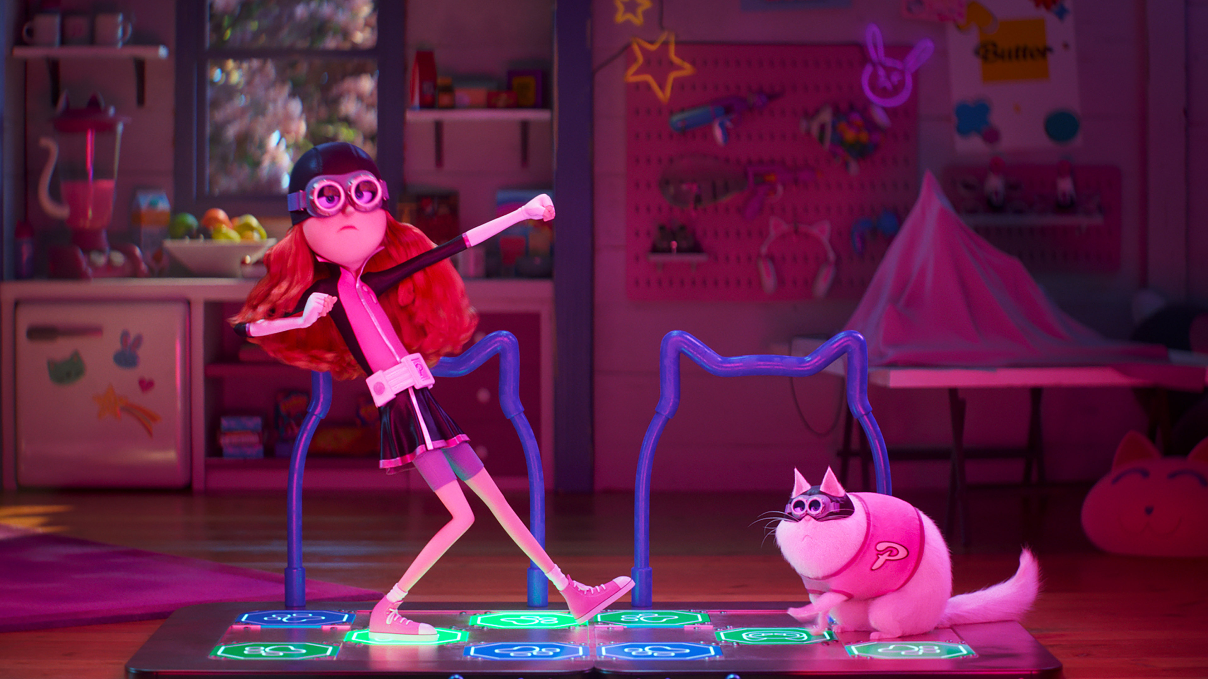 An animated scene featuring a red-haired girl in black clothing and glasses, dancing energetically on a neon-lit dance pad. Beside her, a chubby white cat with a "P" symbol on its back stands on the dance pad, watching her. The background reveals a colorful, cluttered workshop filled with various items—perfect for a heartwarming family movie by Universal Pictures.