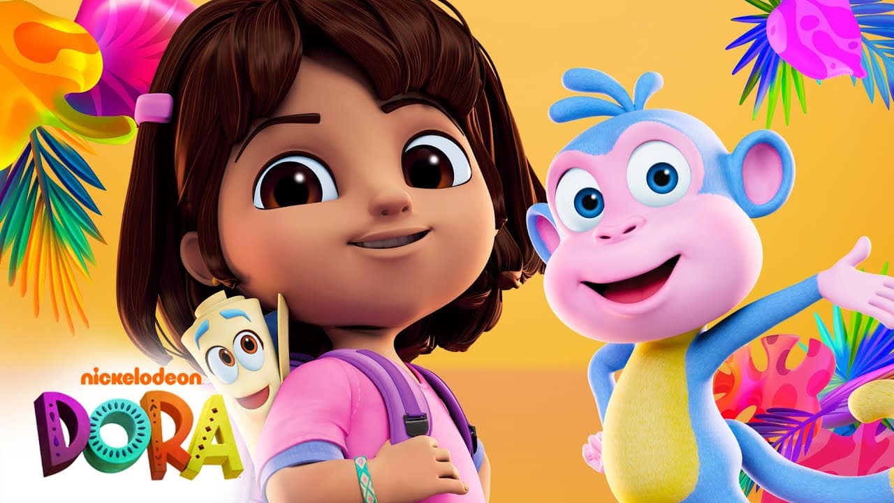 Animated characters Dora and her friend Boots smiling at the viewer against a colorful tropical background. Dora, with brown hair and a pink outfit, has her signature backpack and bracelet. Boots, a blue monkey, stands beside her with an outstretched arm. The Nickelodeon "Dora" logo is at the bottom left.