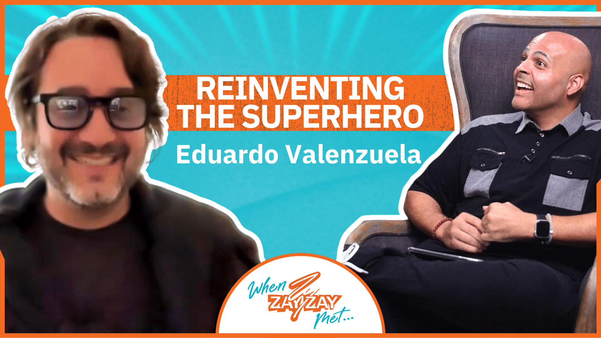 Two men are smiling in an interview setting. The man on the left is shown from the shoulders up, wearing glasses and a dark top, with a blurry background. The man on the right is seated in a chair, wearing a grey and black shirt, holding a notepad. Text: "REINVENTING THE SUPERHERO, Eduardo Valenzuela.