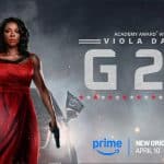 A woman in a red dress holds a rifle and a gun, standing confidently. She is in front of a smokey background with flags. Text reads "Academy Award Winner Viola Davis G20." Prime logo and release date, April 10, are at the bottom. The image conveys intensity and action.