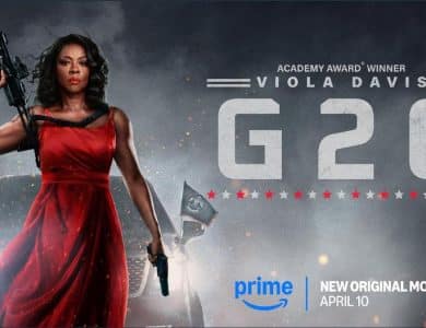 A woman in a red dress holds a rifle and a gun, standing confidently. She is in front of a smokey background with flags. Text reads "Academy Award Winner Viola Davis G20." Prime logo and release date, April 10, are at the bottom. The image conveys intensity and action.