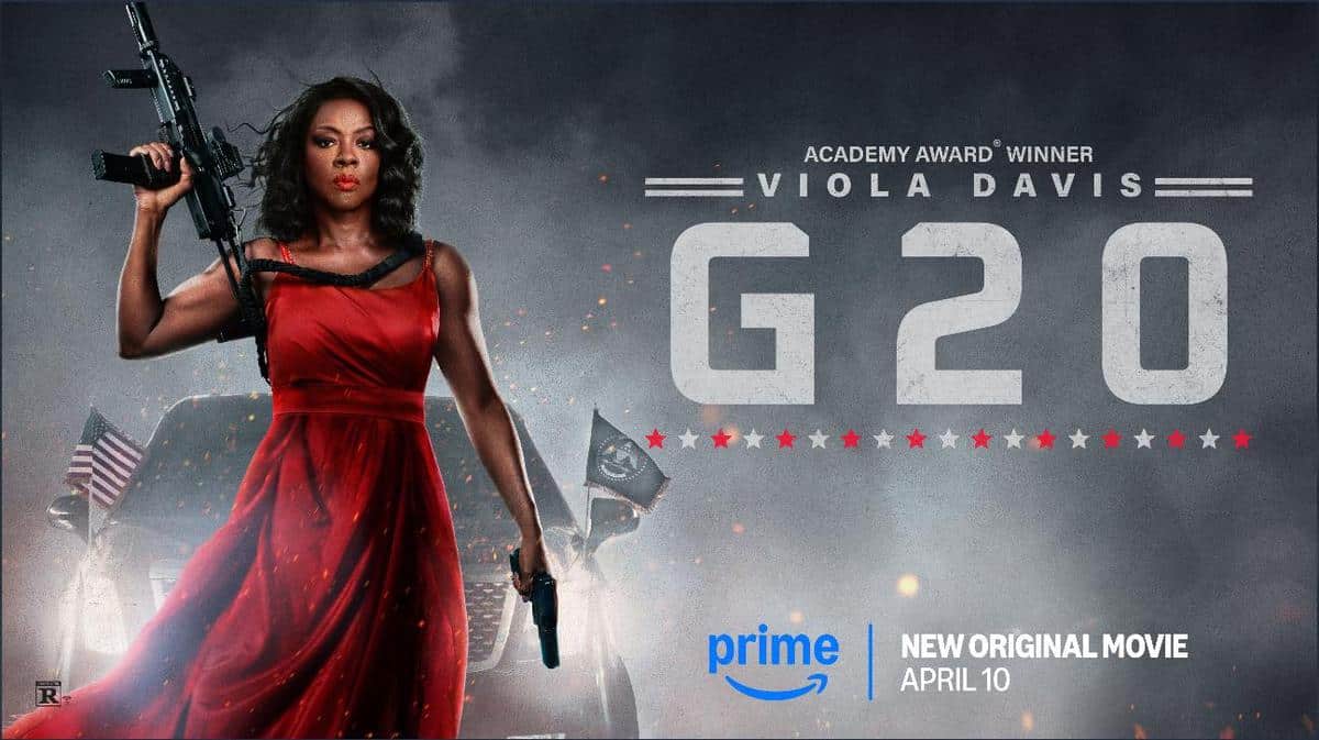 A woman in a red dress holds a rifle and a gun, standing confidently. She is in front of a smokey background with flags. Text reads "Academy Award Winner Viola Davis G20." Prime logo and release date, April 10, are at the bottom. The image conveys intensity and action.