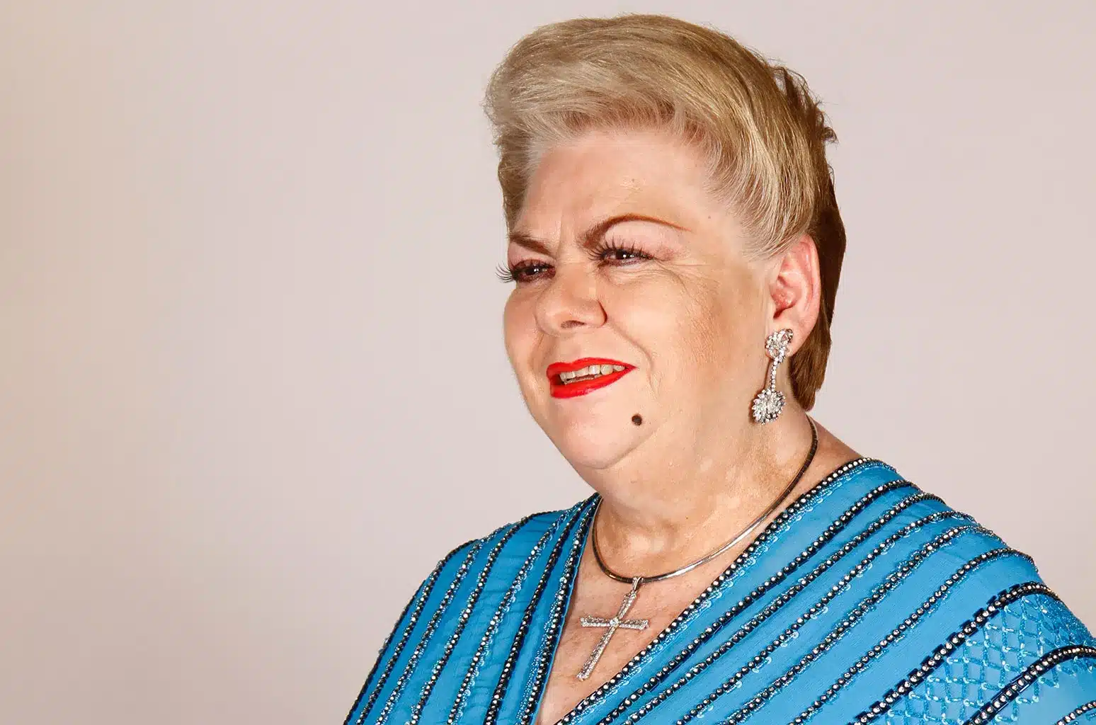 Paquita la del Barrio, a woman in a blue dress.  Paquita-La-Del-Barrio-press-2021-billboard-1548-1629979266.webp