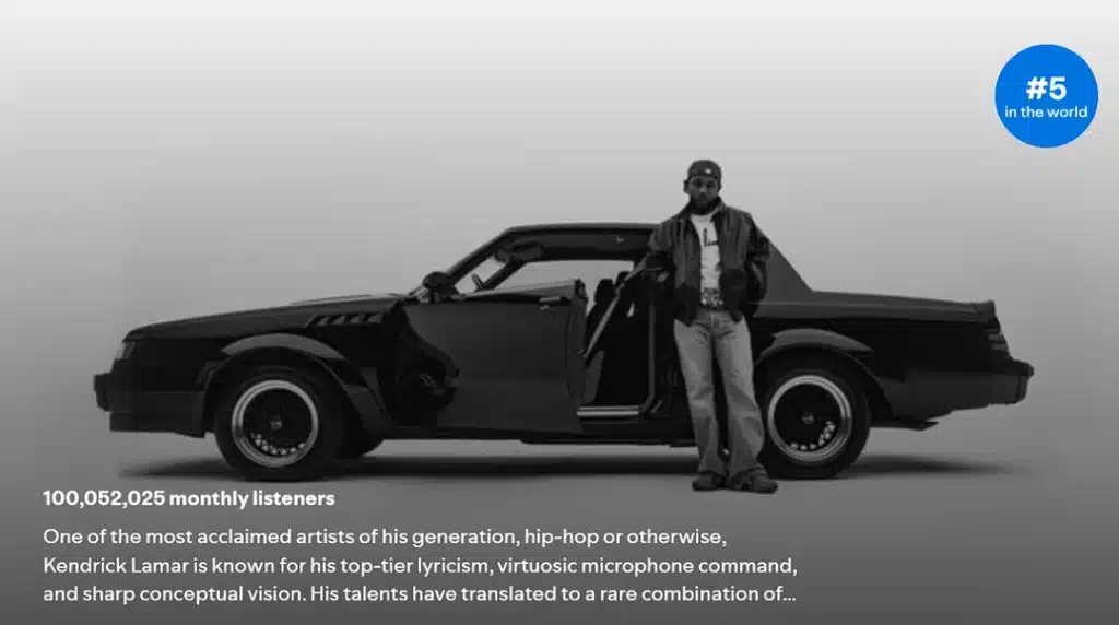 In a black and white image, a man stands by a sleek vintage car with open doors, donning casual attire. A large blue circle announces "#5 in the world," as text below celebrates his GNX album dominating charts, following Kendrick Lamar's triple album record success.