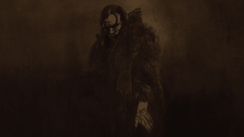 A dark, moody image evokes the chilling atmosphere of Netflix’s Frankenstein. A figure in heavy fur with long hair and sinister, skull-like face paint stretches a hand downward, shrouded in shadows—offering a haunting first look at this adaptation.